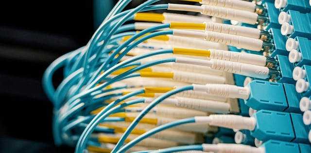 Business team discussing around laptop